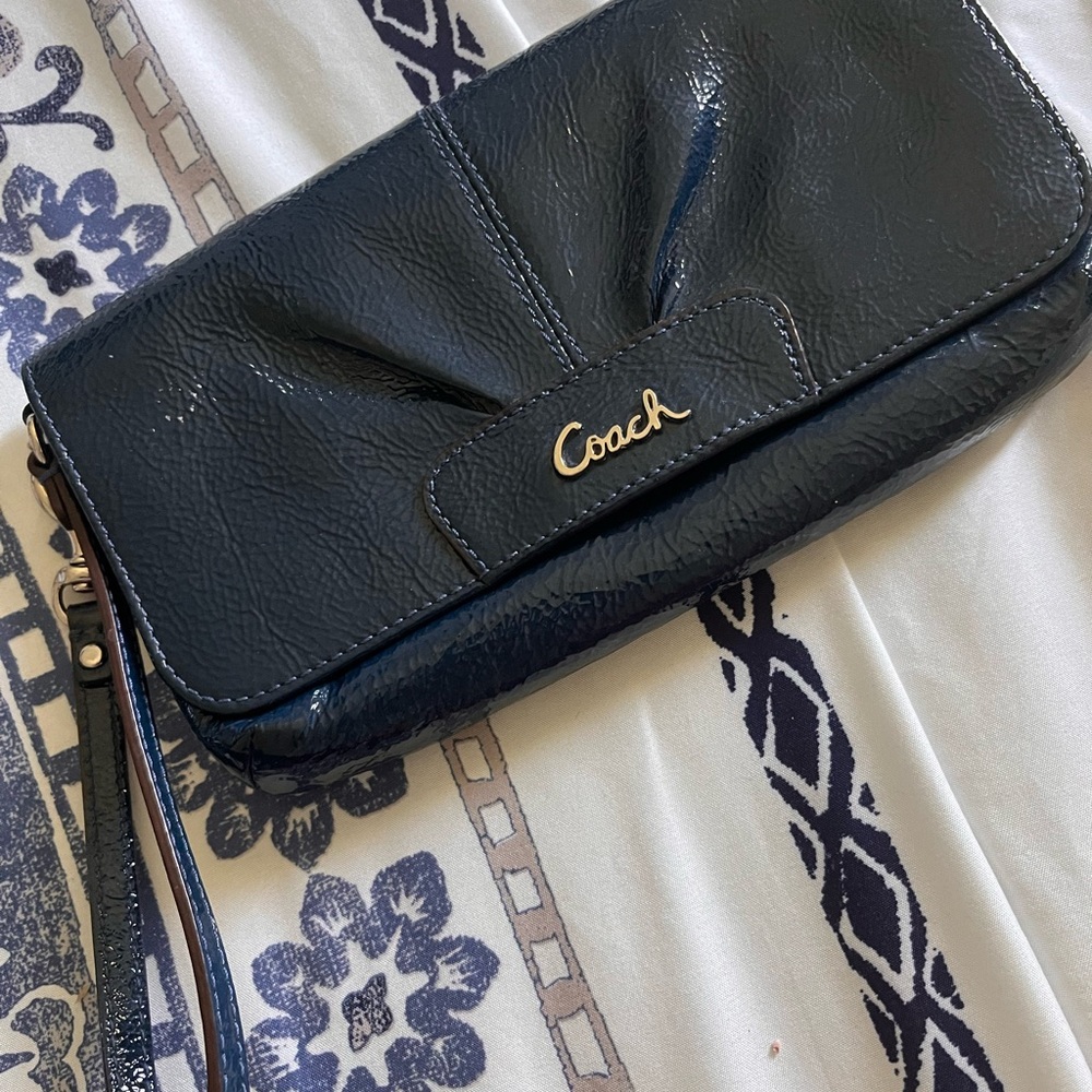 Navy Blue Coach Brand patent leather wristlet. Used, in brand new condition.